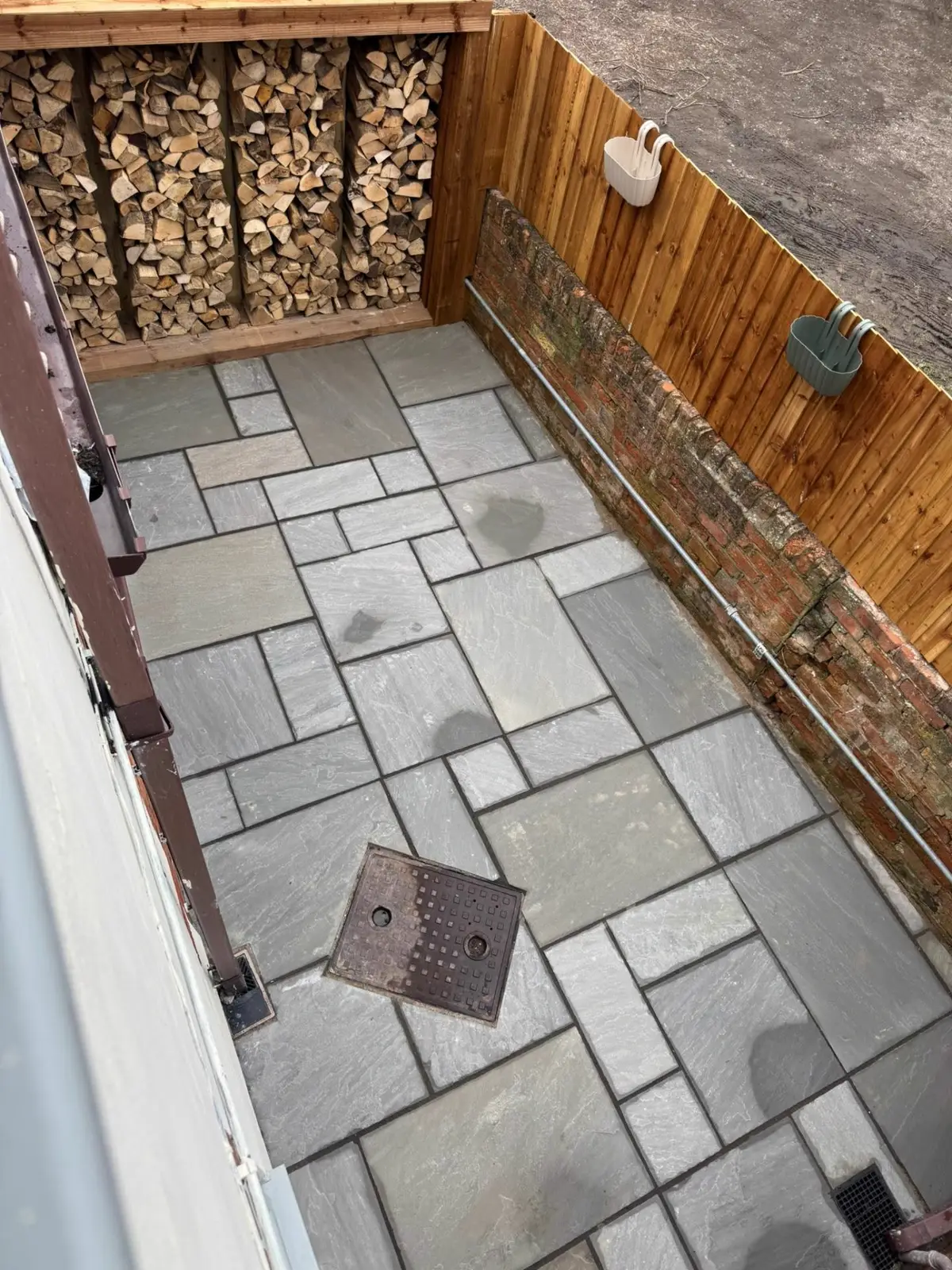 Rear garden paving & log store completed by IDL Property Services